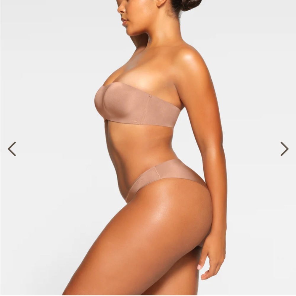 SKIMS Wireless Form Strapless Bra in classic shade Sienna color.